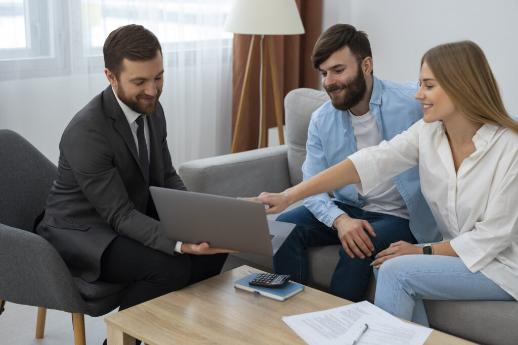 male real estate agent doing business showing house potential buying couple 1